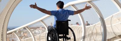 Manual wheelchair Küschall Champion black frame man on the bridge